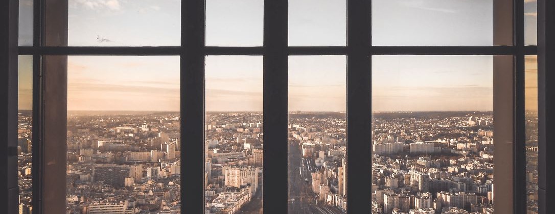 A window looking out onto a city. 