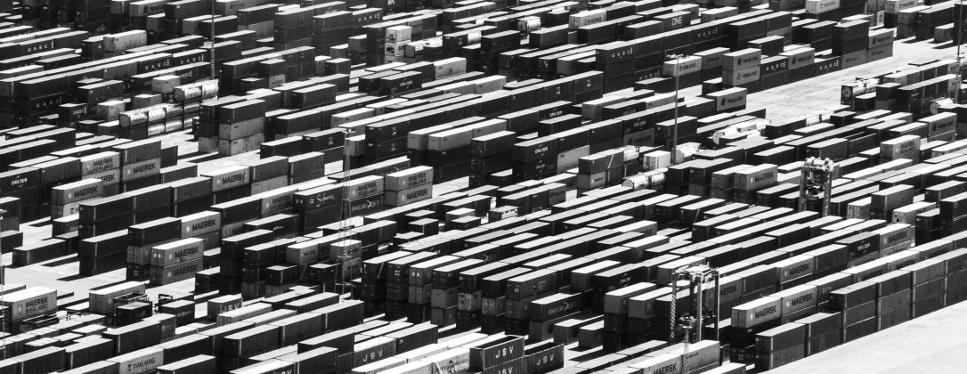 a shipping yard with numerous shipping containers.