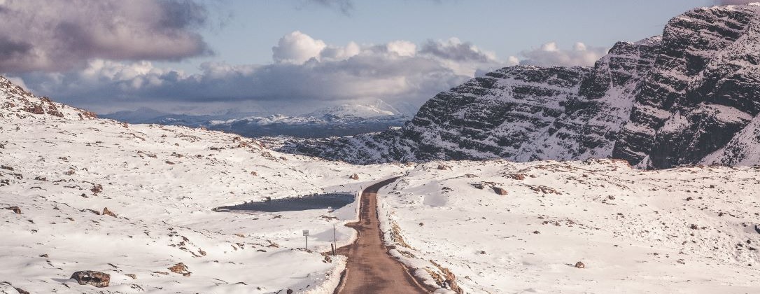 winding roadway through a winter landscape.