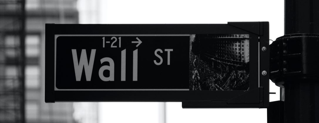 a street sign that says "Wall Street"
