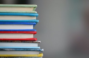 a stack of multicolored books. 