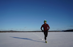 a man running in thin snow.
